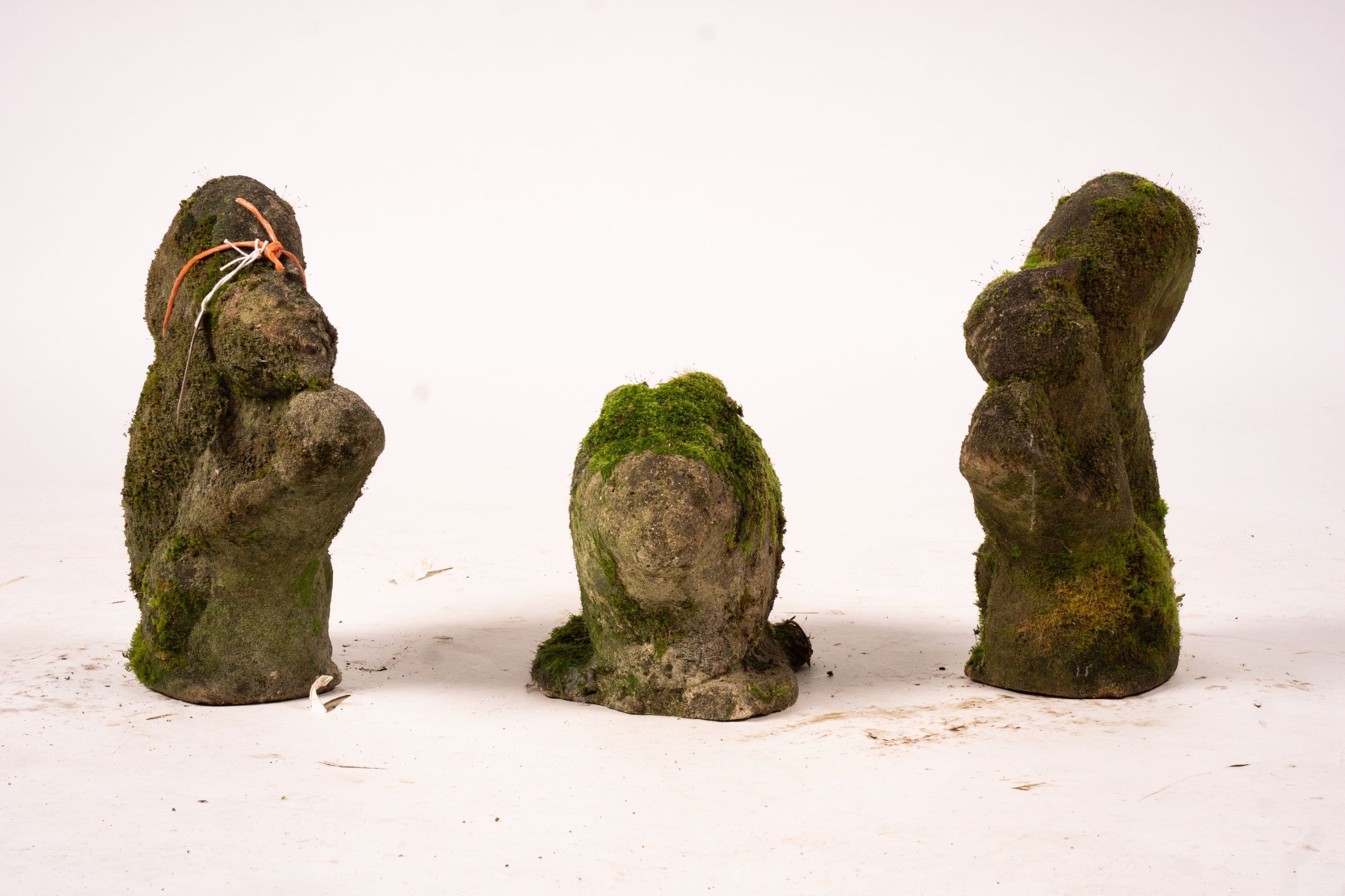 Three reconstituted stone garden ornaments, squirrels and rabbit, tallest 34cm